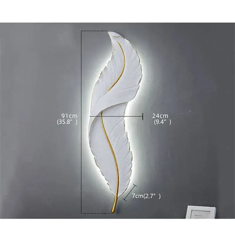 Decorative wall light shaped like a feather with measurements on a gray background