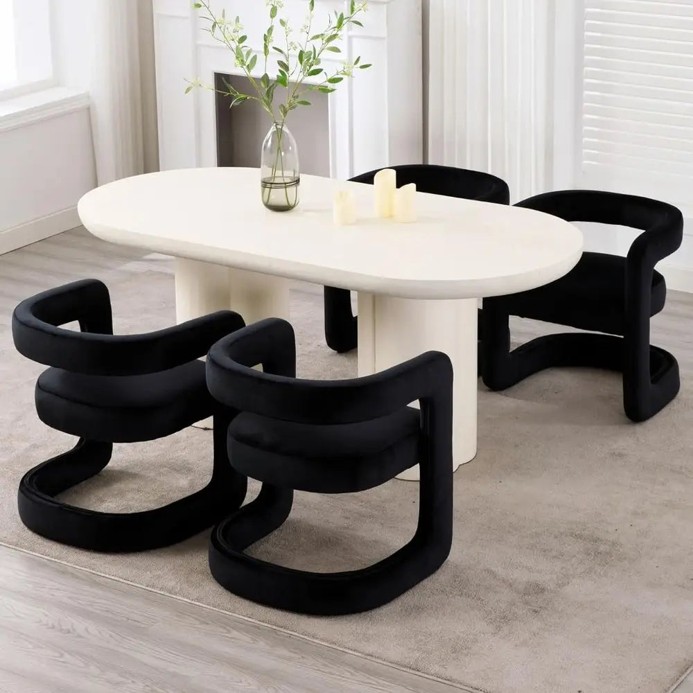 Luxury upholstered dining chairs arranged around a modern oval dining table with a minimalist design.