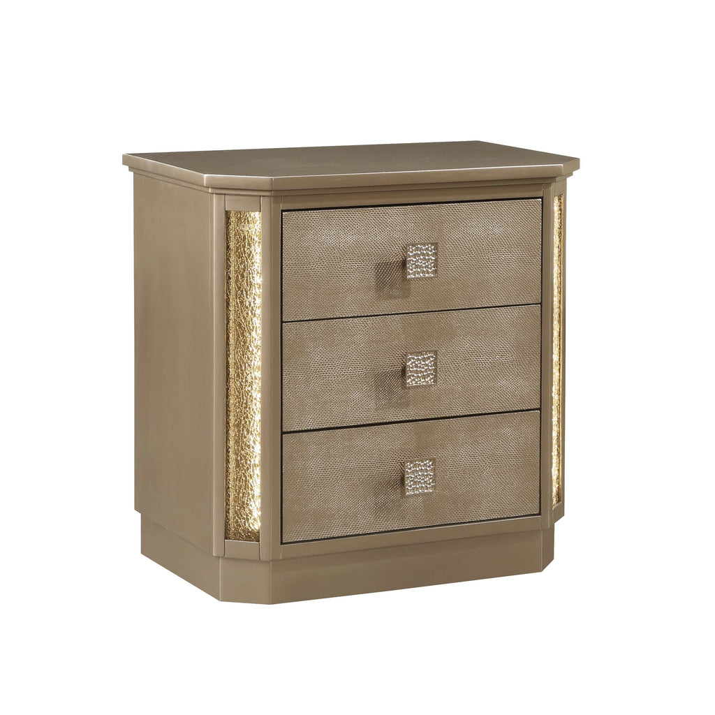 Beige nightstand with three drawers and decorative handles on a white background