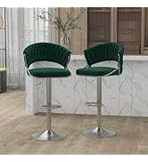 Two green bar stools with chrome bases on a light wood floor.