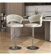 Two white bar stools with metallic bases on a wooden floor.