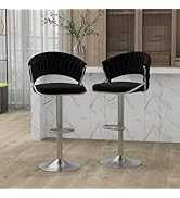 Two black bar stools with chrome bases on a tiled floor.