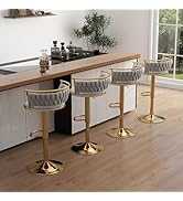 Three bar stools with gold legs and gray seats in a kitchen setting.