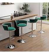 Three green bar stools with metal bases in a modern kitchen setting.