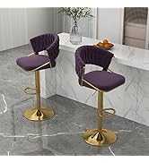 Two purple bar stools with gold bases on a tiled floor.