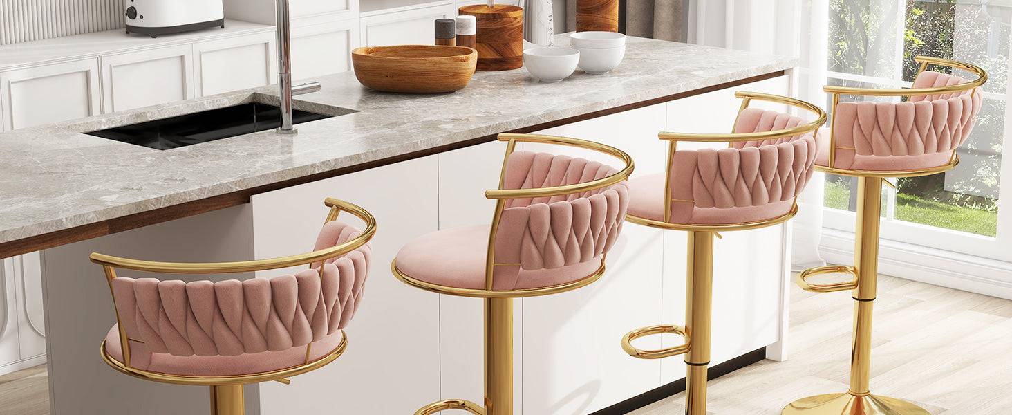 Pink bar stools with gold legs in a modern kitchen setting