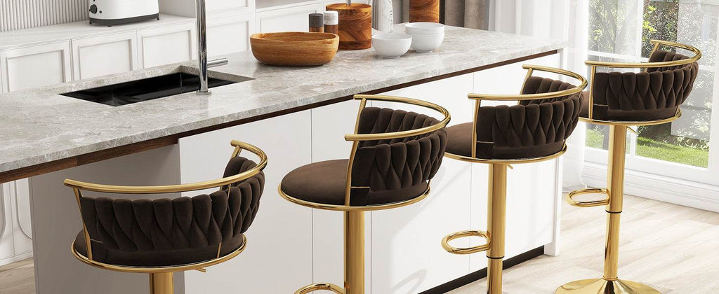 Modern kitchen with marble island and black bar stools with gold legs