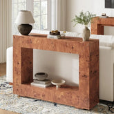 Wooden console table in a living room with decorative items.