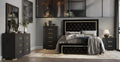 Luxury tufted velvet round bed in a contemporary bedroom setting with black and gold accents.