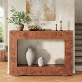 Wooden console table with decorative items in a room setting