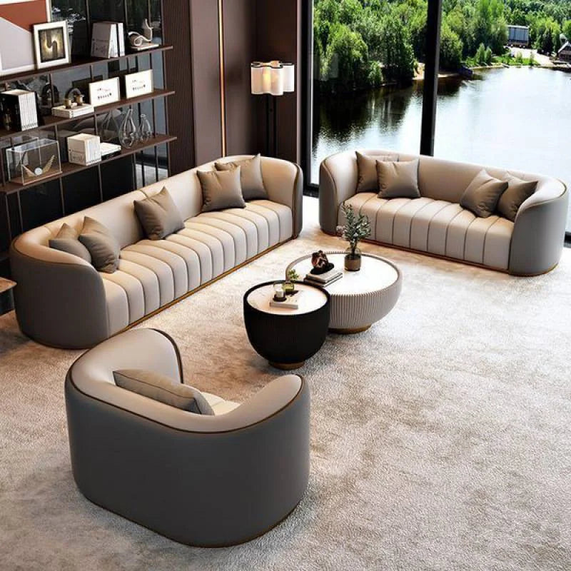 Modern luxury leather modular sofa in a stylish living room setting with large windows and elegant decor.