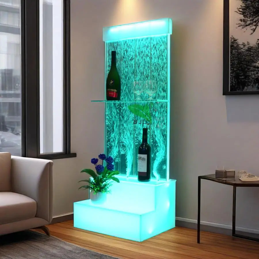 Acrylic water bubble bar cabinet with LED lights, three shelves, and decorative plant, perfect for modern interiors.