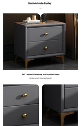 Gray bedside table with gold handles on a dark background