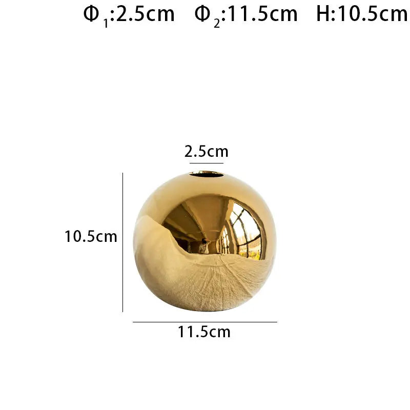 Gold spherical object with dimensions labeled on a white background