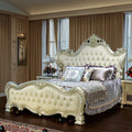 European style solid wood bed with ornate detailing and luxurious upholstery in a villa master bedroom.