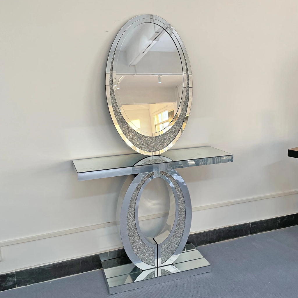 Decorative console table with mirror against a white wall