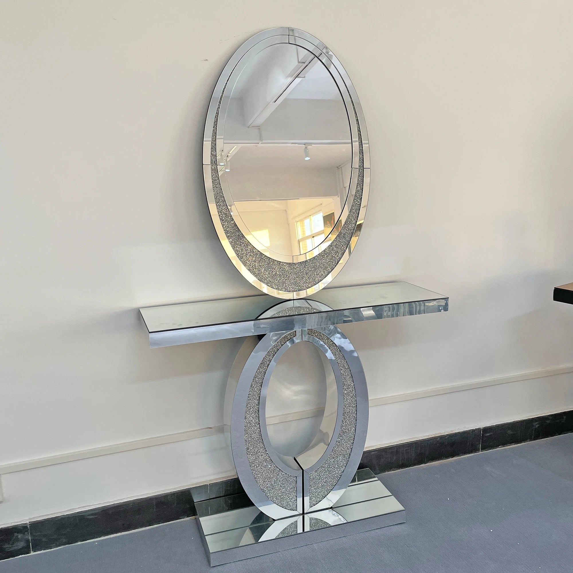 Decorative console table with mirror against a white wall