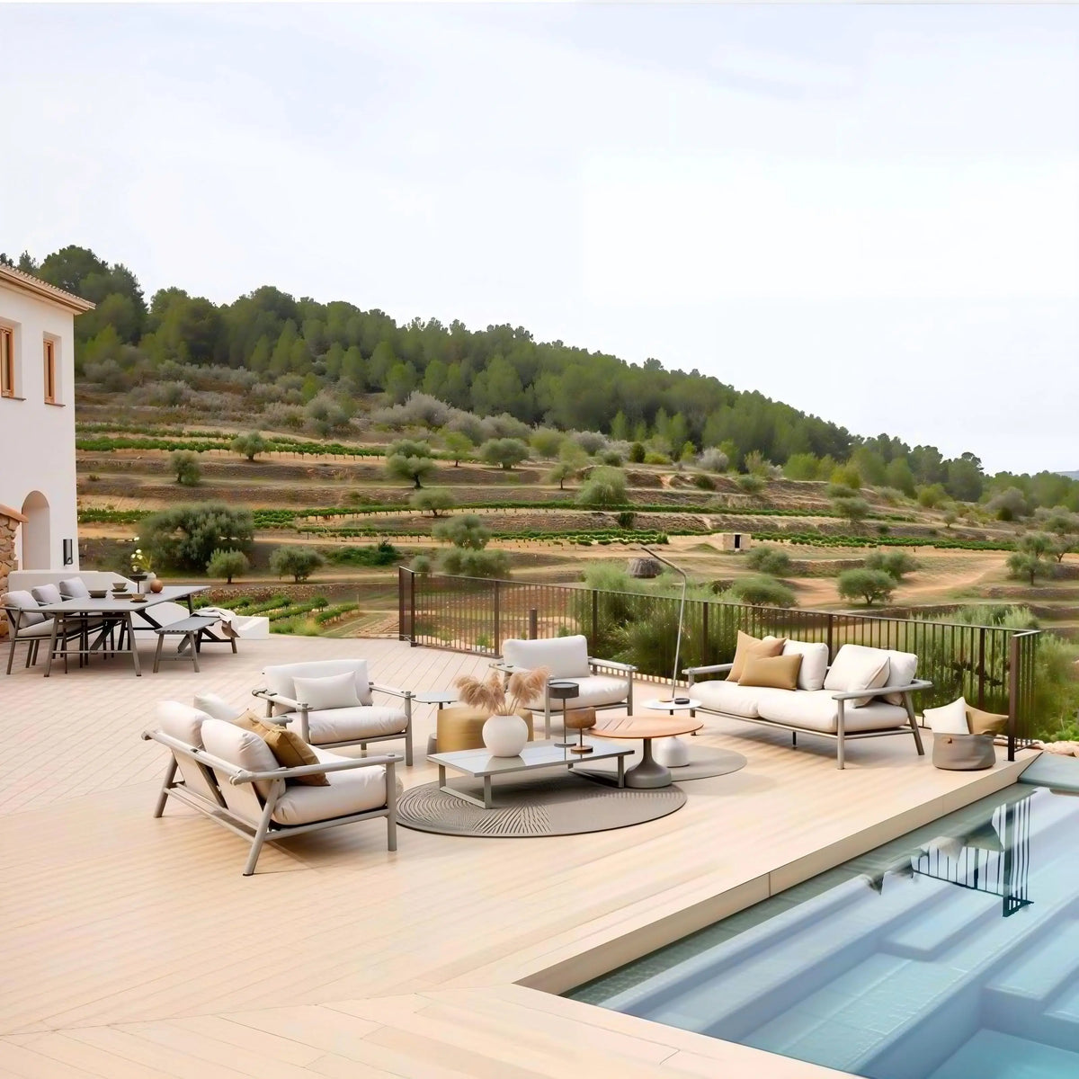 custom rainproof outdoor sofa set on a stylish terrace with a scenic landscape and swimming pool.