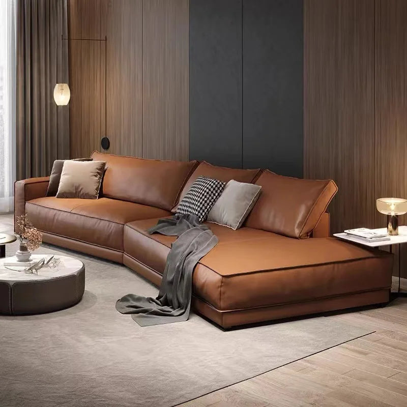 Italian minimalist leather sectional sofa in brown leather, featuring clean lines and a modern design for elegant living rooms.