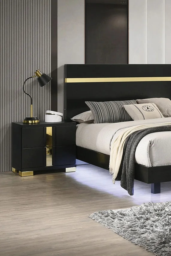 Modern king bedroom set with LED lighting featuring black and gold design, bedside lamp, and nightstand.