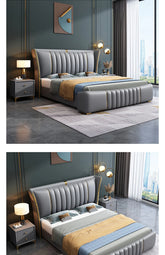 Gray upholstered bed with gold accents in a modern bedroom setting.