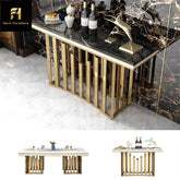 Luxury console table with marble top and gold base in a room setting.