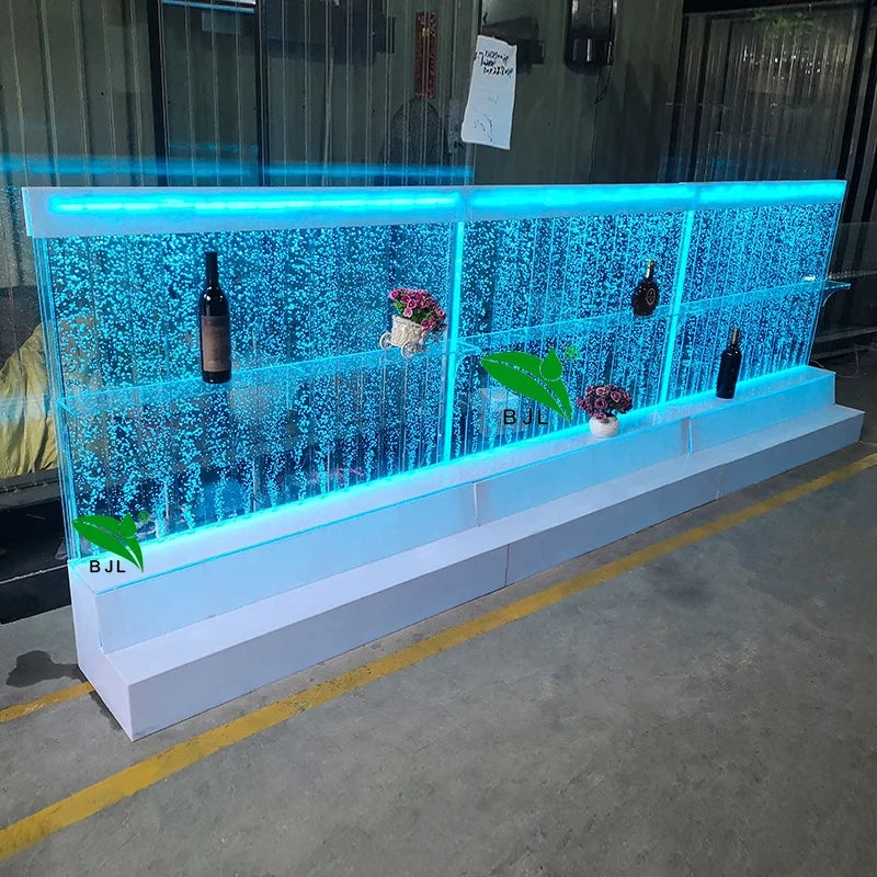 Acrylic water bubble bar cabinet with LED lights and three display shelves showcasing bottles and decorations.