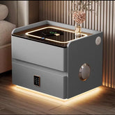 Modern side table with LED lighting and decorative elements in a room setting.