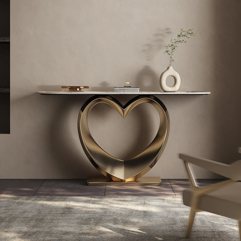 Luxury marble console table with heart-shaped gold base, a beautiful statement piece for modern apartments.