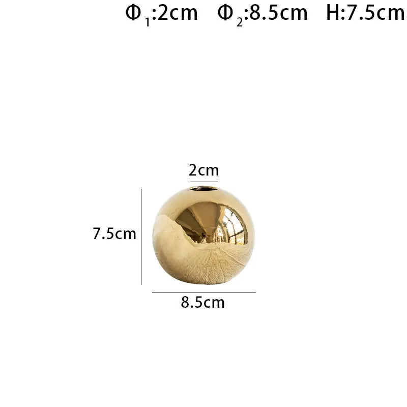 Gold spherical object with dimensions labeled on a white background