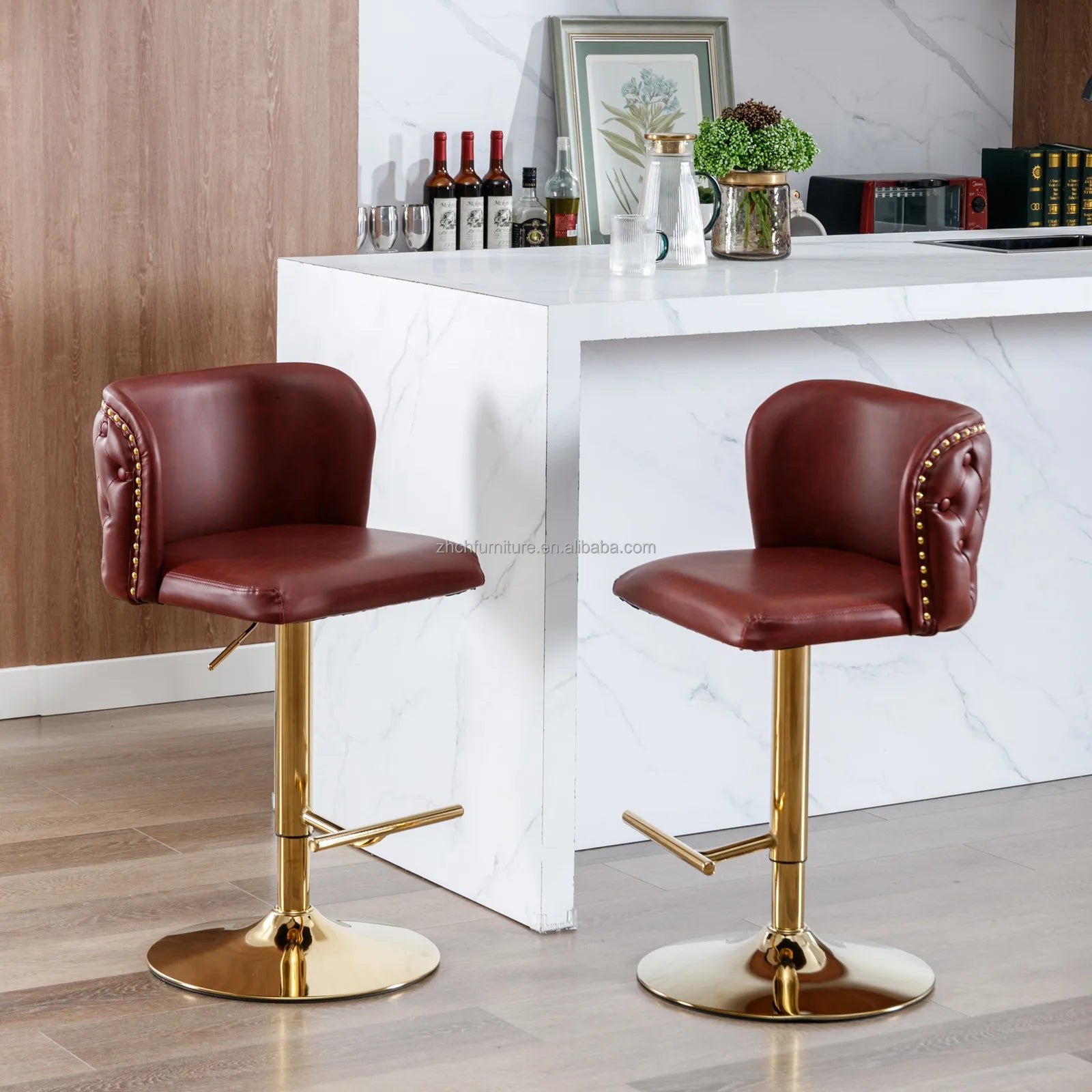 Set of 2 Leather Swivel Adjustable Bar Stools with golden base and tufted PU leather in rich burgundy.