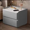 Smart nightstand with wireless charging and USB connectivity in modern bedroom setting.