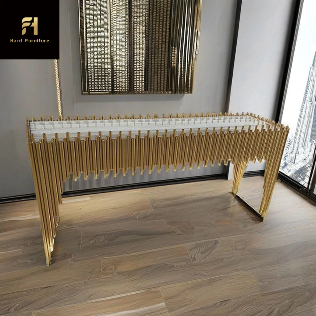 Gold titanium marble console table with geometric design and luxurious finish in modern interior setting.