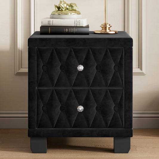 Black tufted nightstand with decorative knob on a wooden floor.