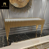Decorative console table with gold accents in a stylish interior setting.