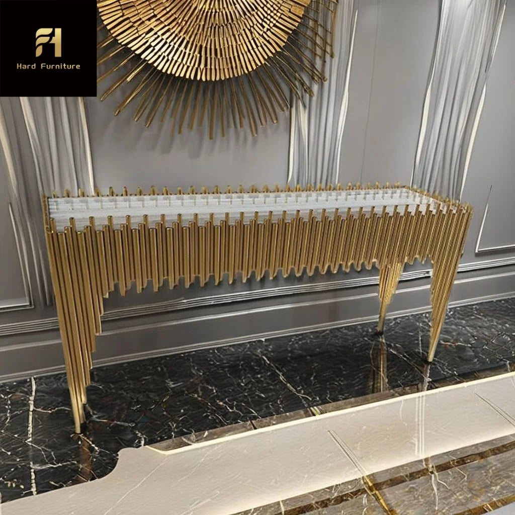 Gold titanium marble console table with a sculptural geometric design and pristine marble top.