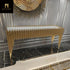 Decorative console table with gold accents in a stylish interior setting.