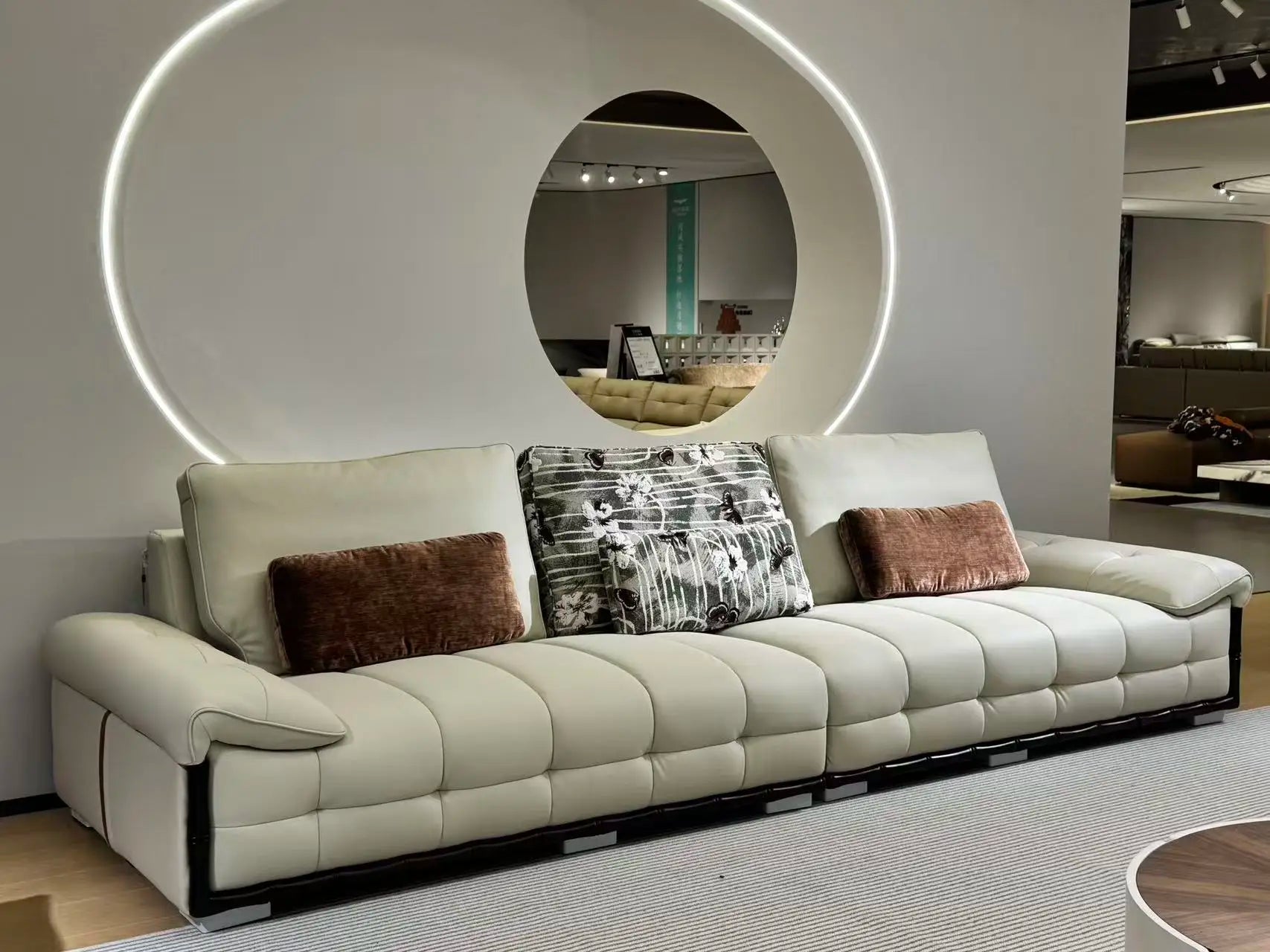 Customizable luxury modular sectional sofa in eco-leather with cloud cushioning, stylish design in rice white.