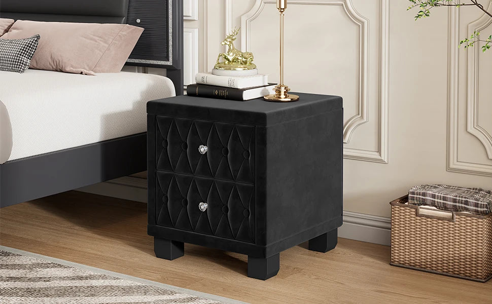 Black nightstand with decorative items in a bedroom setting