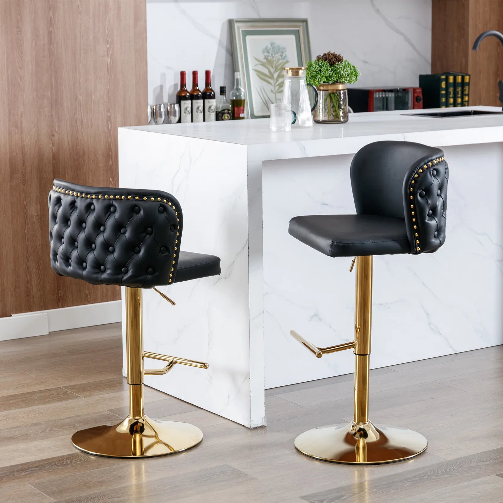 Set of 2 Leather Swivel Adjustable Bar Stools in black tufted PU leather with golden bases and nailhead trim.