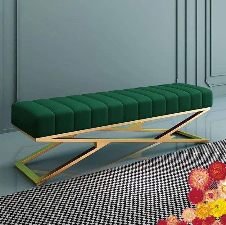 Modern tufted velvet bench featuring a green tufted fabric and a sleek stainless steel base, perfect for any elegant space.