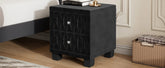 Black nightstand with diamond pattern on a wooden floor