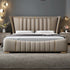 Beige upholstered bed with tufted design in a bedroom setting.