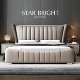 Beige upholstered bed with tufted headboard in a bedroom setting, featuring &