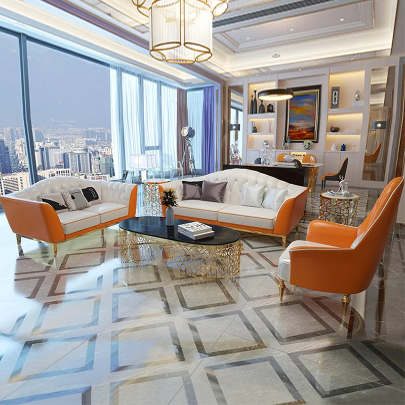Tufted leather modular sofa in elegant living room with gold stainless steel legs, featuring buff, brown, and orange colors.