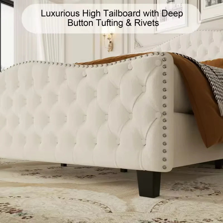 Luxurious high tailboard with deep button tufting and rivets in a bedroom setting.