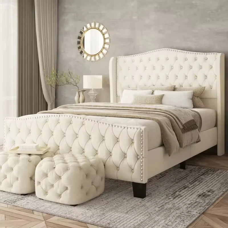Contract-Grade Tufted Velvet Wingback Bed with button tufting and silver nailhead trim in a stylish bedroom setting.