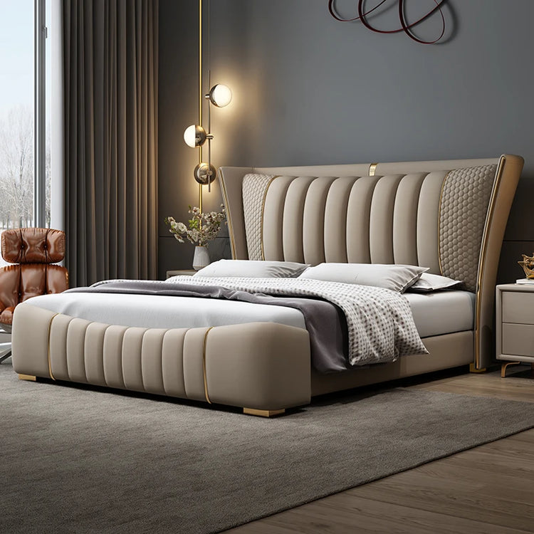 Beige upholstered bed in a modern bedroom setting with decorative elements.