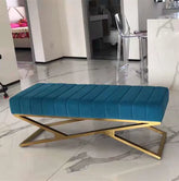 Blue bench with gold legs on a marble floor