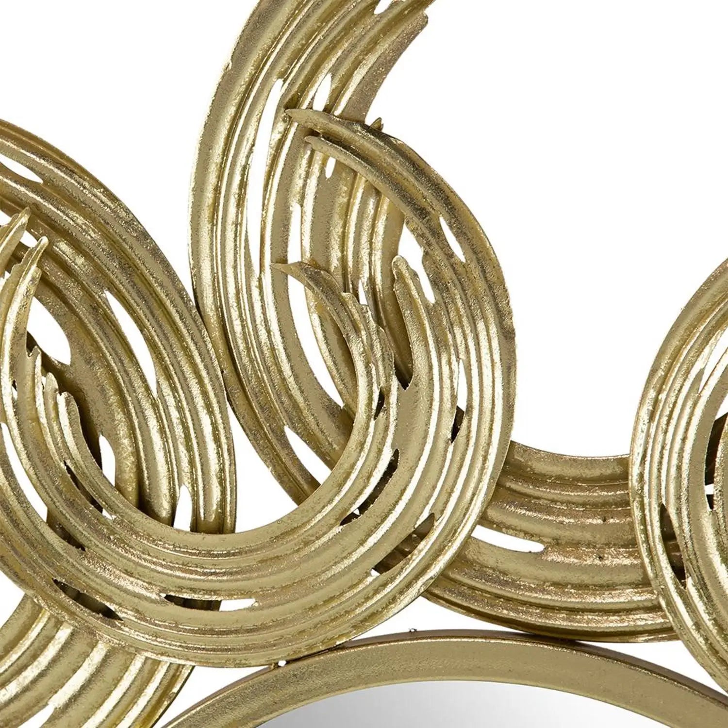 Close-up of a gold decorative mirror with interlocking circular designs on a white background